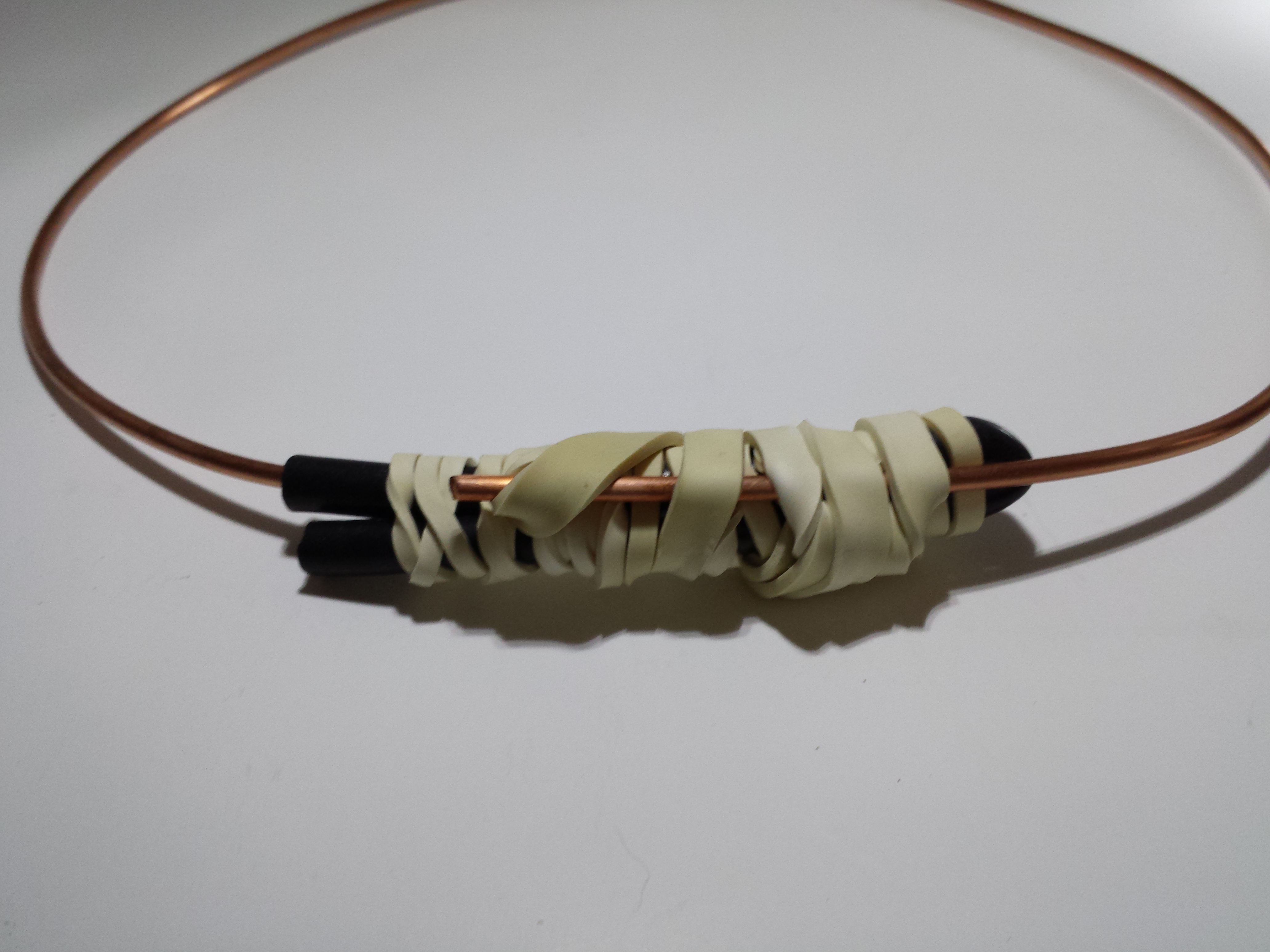 Copper wire secured with rubber band