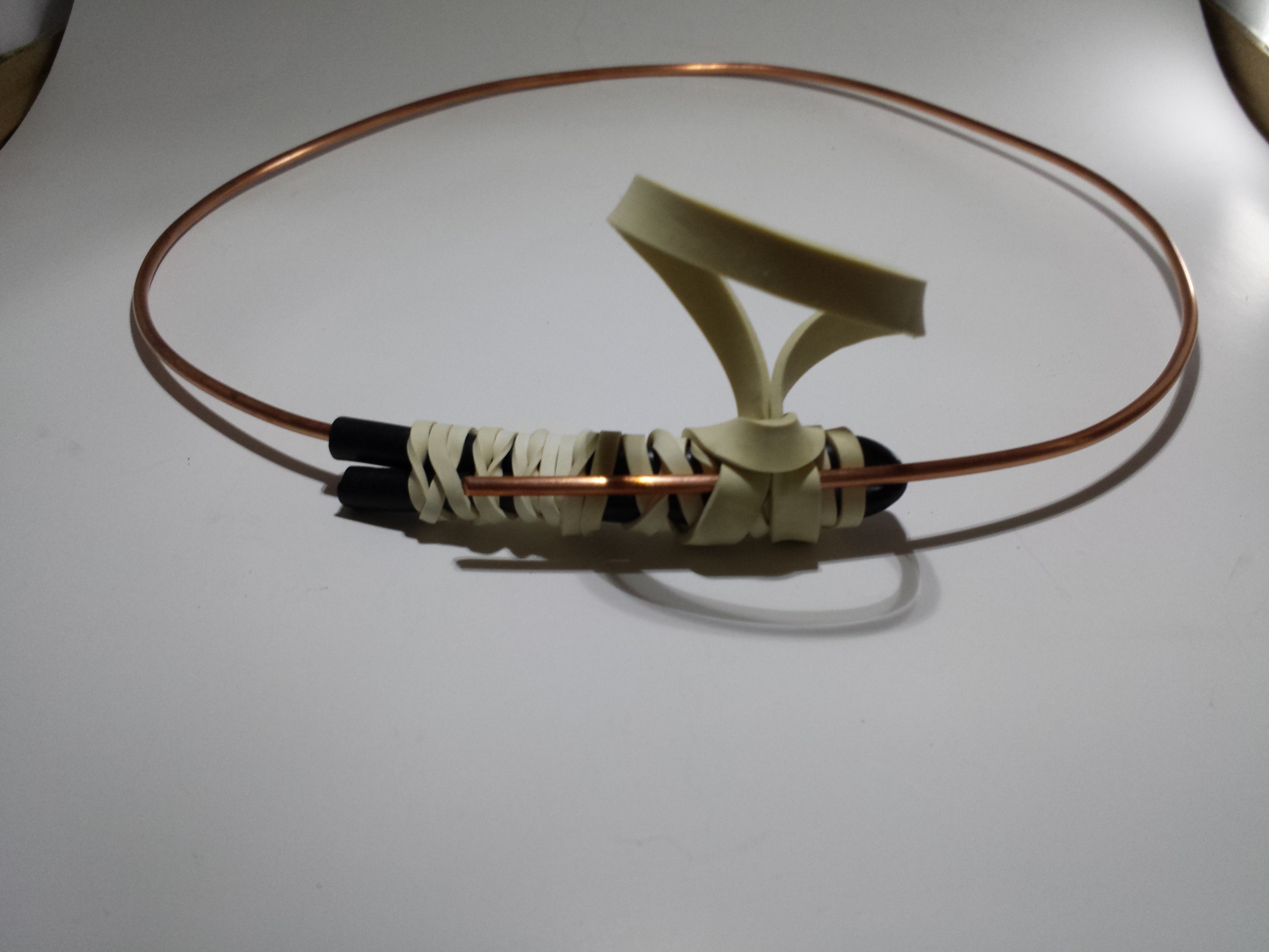 copper wire showing how to secure with rubber band